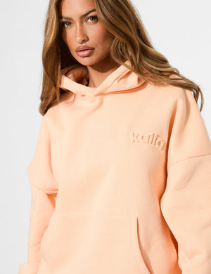 Kaiia Embossed Logo Oversized Hoodie Orange Sherbet