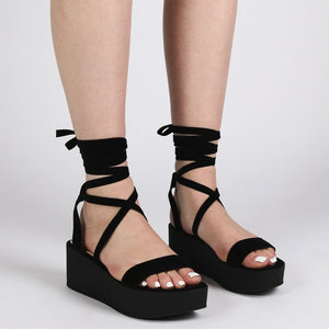 Diya Flatform Sandals in Black Faux Suede